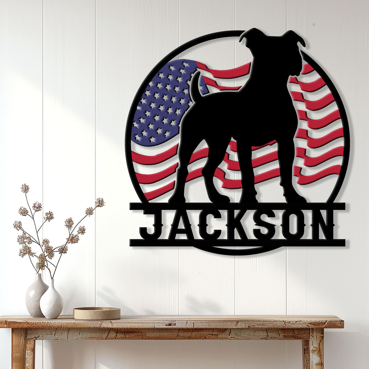 Patriotic pitbull wall sign displayed on a white paneled wall above a wood console