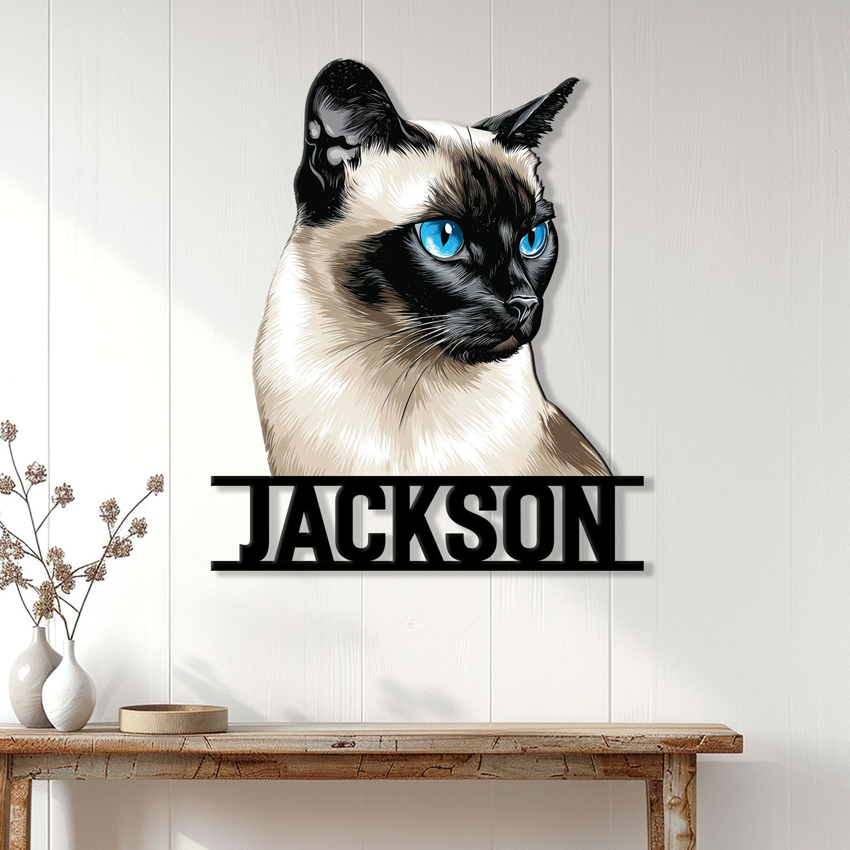 Siamese cat metal wall sign displayed on a light paneled wall above a console table