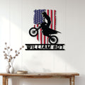Patriotic motocross metal sign displayed as wall decor above a console table in a bright home