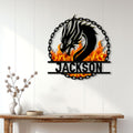 Fiery dragon metal wall sign displayed above a console table in a bright home entryway