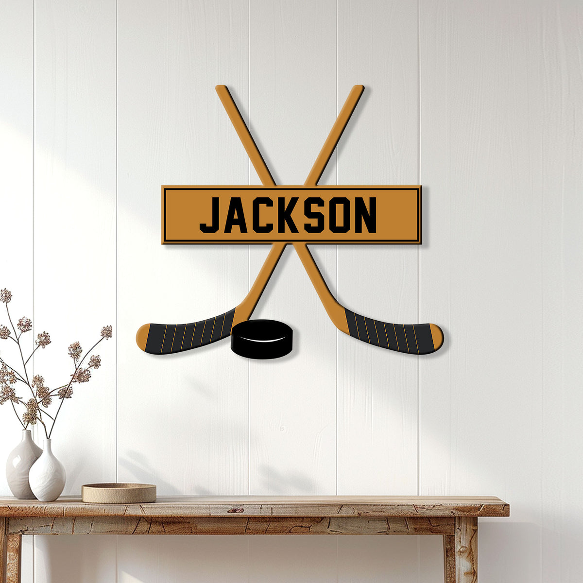 Hockey wall decor displayed on a white paneled wall above a rustic console table