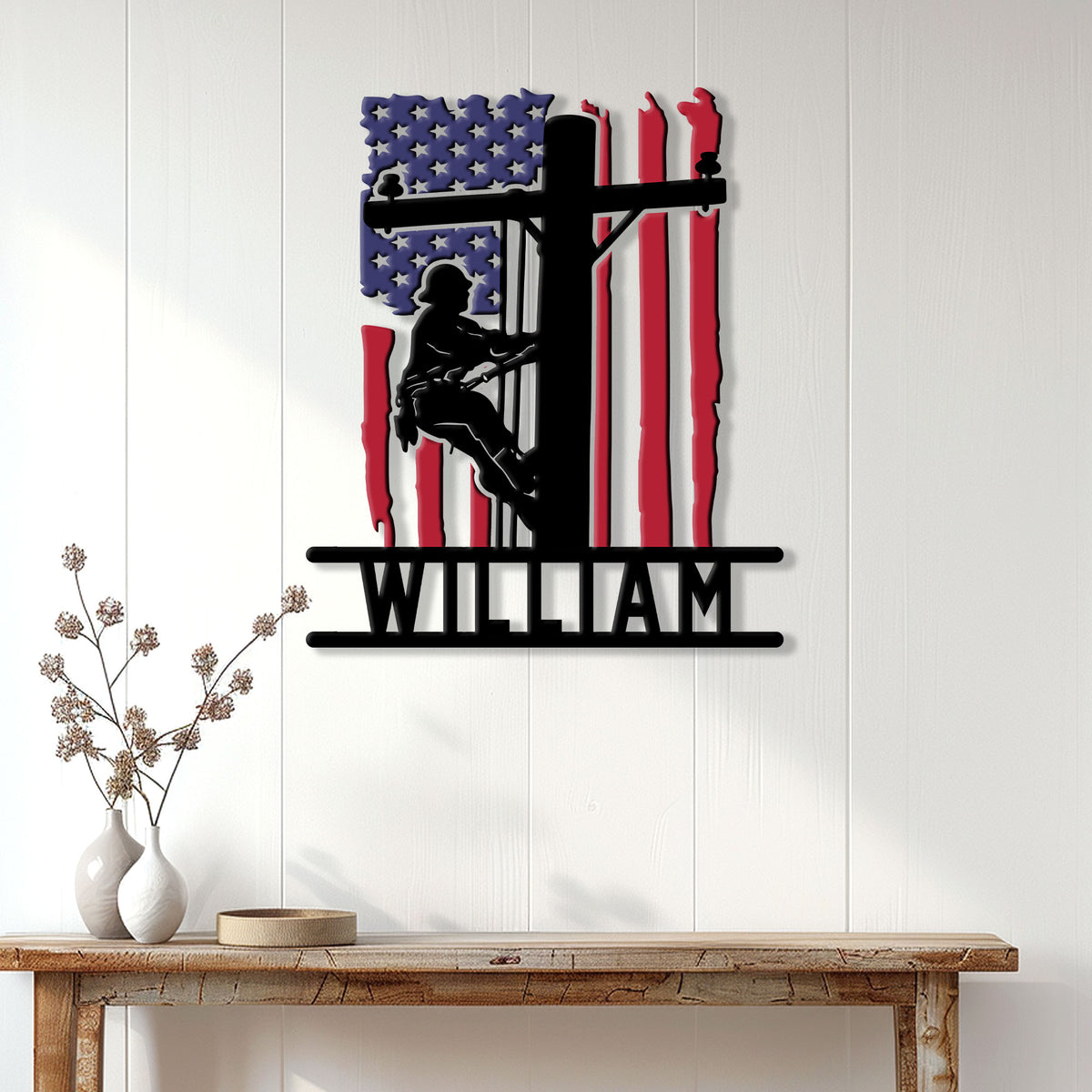 Patriotic lineman wall sign displayed on white paneling above a console table in a home interior