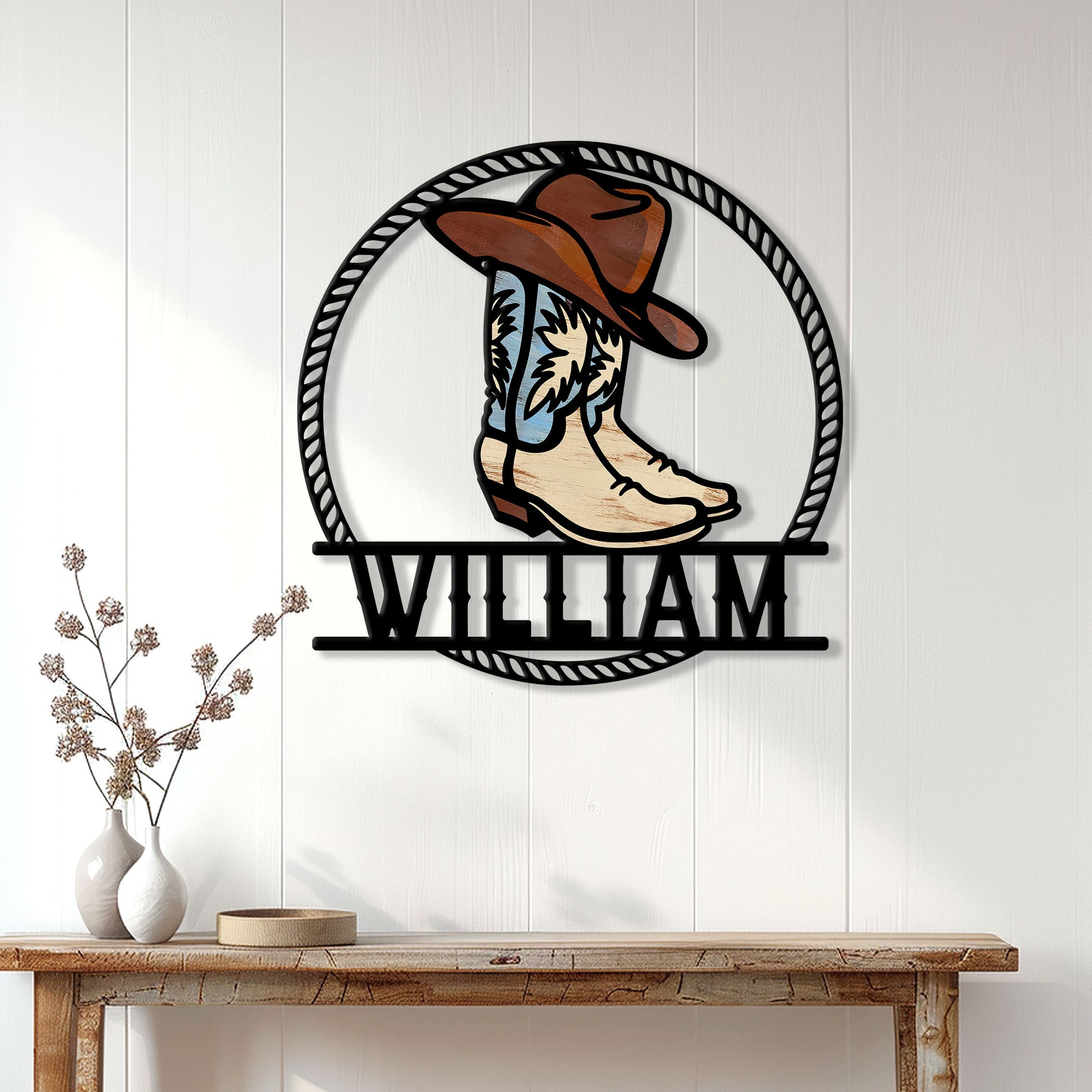 Cowboy boots wall sign displayed on a white paneled wall above a rustic console table