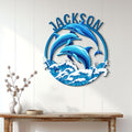 Dolphin wall sign displayed on a white paneled wall above a wood console table