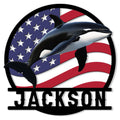Orca metal sign featuring a breaching killer whale over a waving American flag design