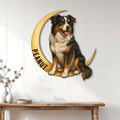 Australian Shepherd wall sign displayed on a light wood-paneled wall above a console table