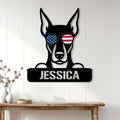 Patriotic Doberman metal sign displayed as wall decor in a bright home entryway