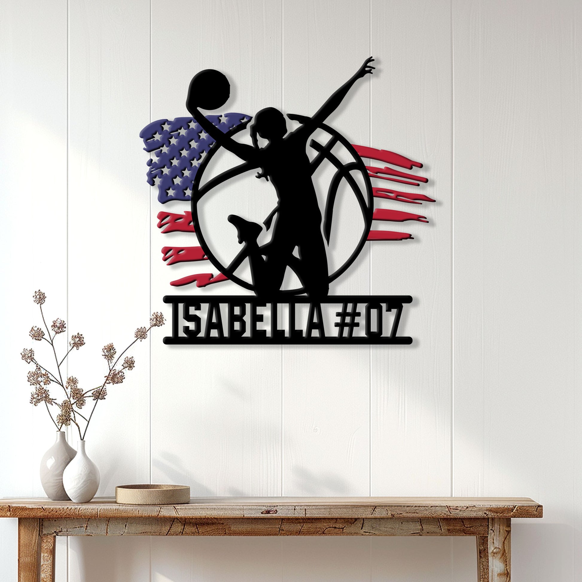 Patriotic volleyball metal wall sign displayed above a console table in a bright home interior