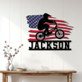 Patriotic BMX wall decor displayed on a white paneled wall above a console table