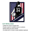 Cut metal volleyball sign showing a female athlete with a volleyball and bold red, white, and blue flag backdrop