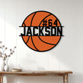 Basketball metal sign displayed on a white paneled wall as sporty home decor