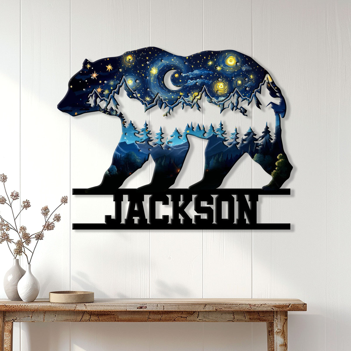 Bear-shaped night sky metal wall sign displayed on a white paneled wall above a console table