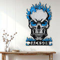 Blue flame flaming skull metal sign displayed on a light paneled wall