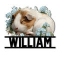 Floral guinea pig metal sign featuring a sleeping brown and white guinea pig surrounded by blue flowers