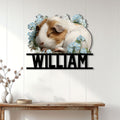 Floral guinea pig wall sign displayed on a light paneled wall above a rustic console table