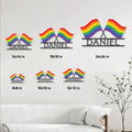 Pride rainbow metal sign shown in multiple size options on a living room wall