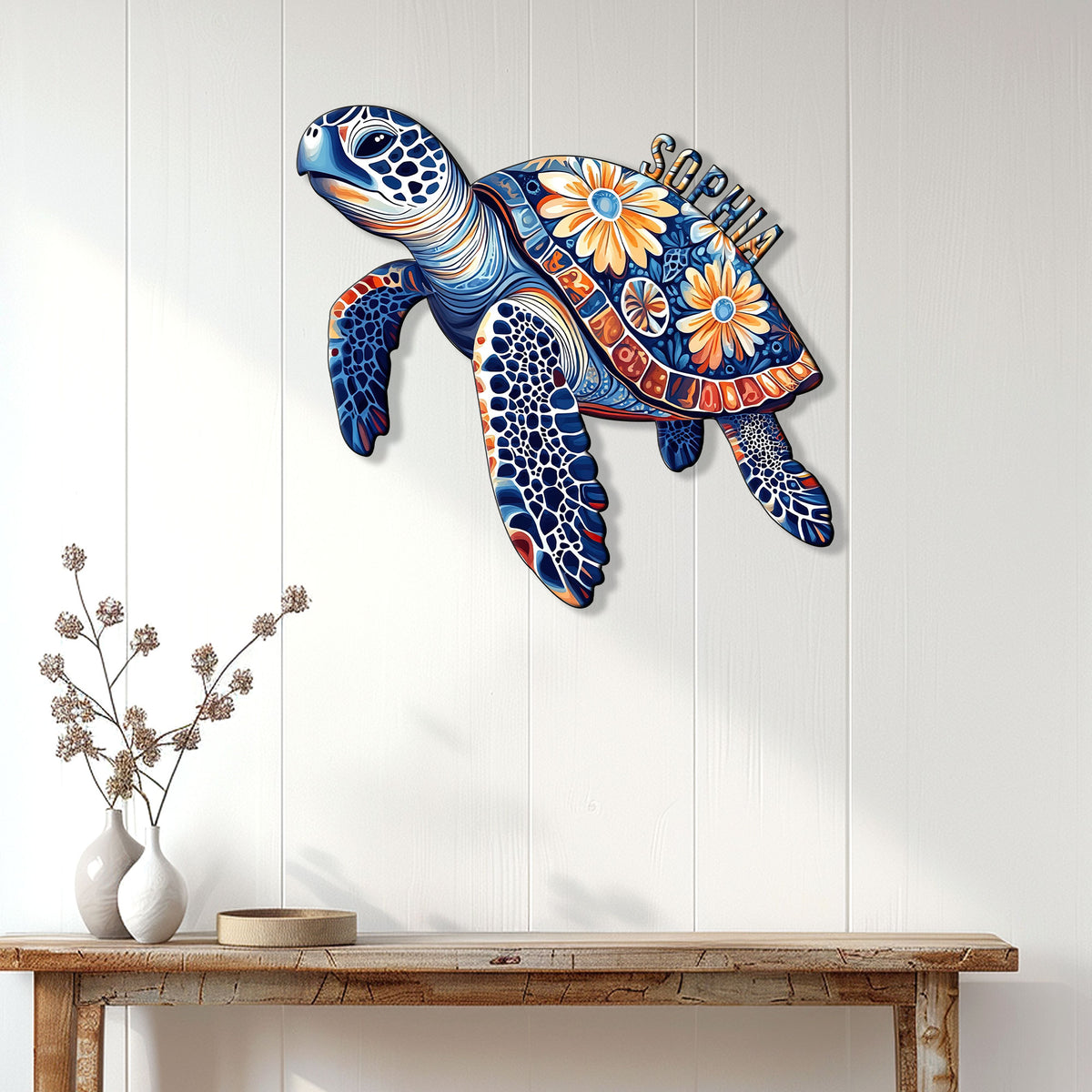 Colorful floral sea turtle wall sign displayed above a console table in a bright home