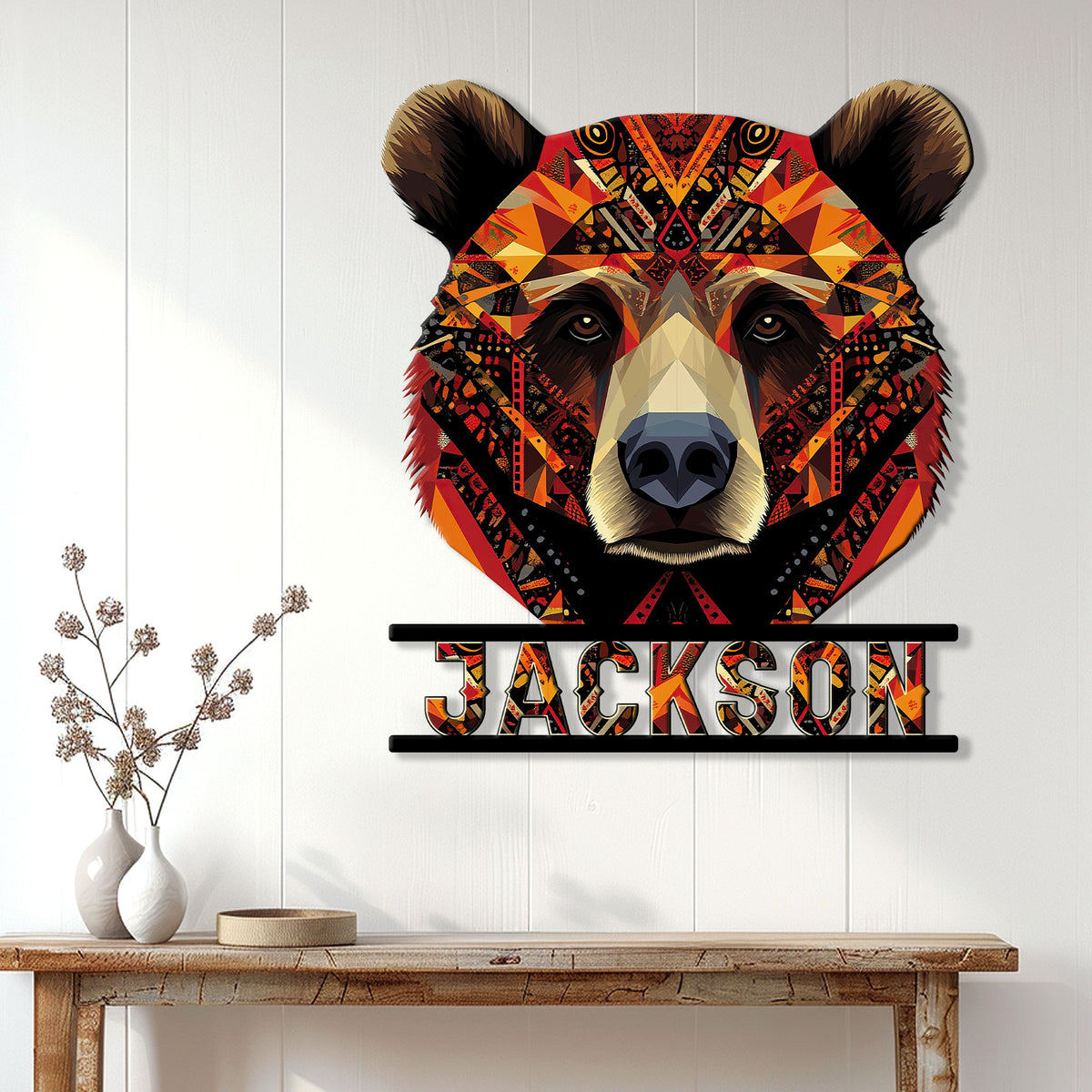 Colorful bear wall sign displayed above a console table in a bright modern home interior