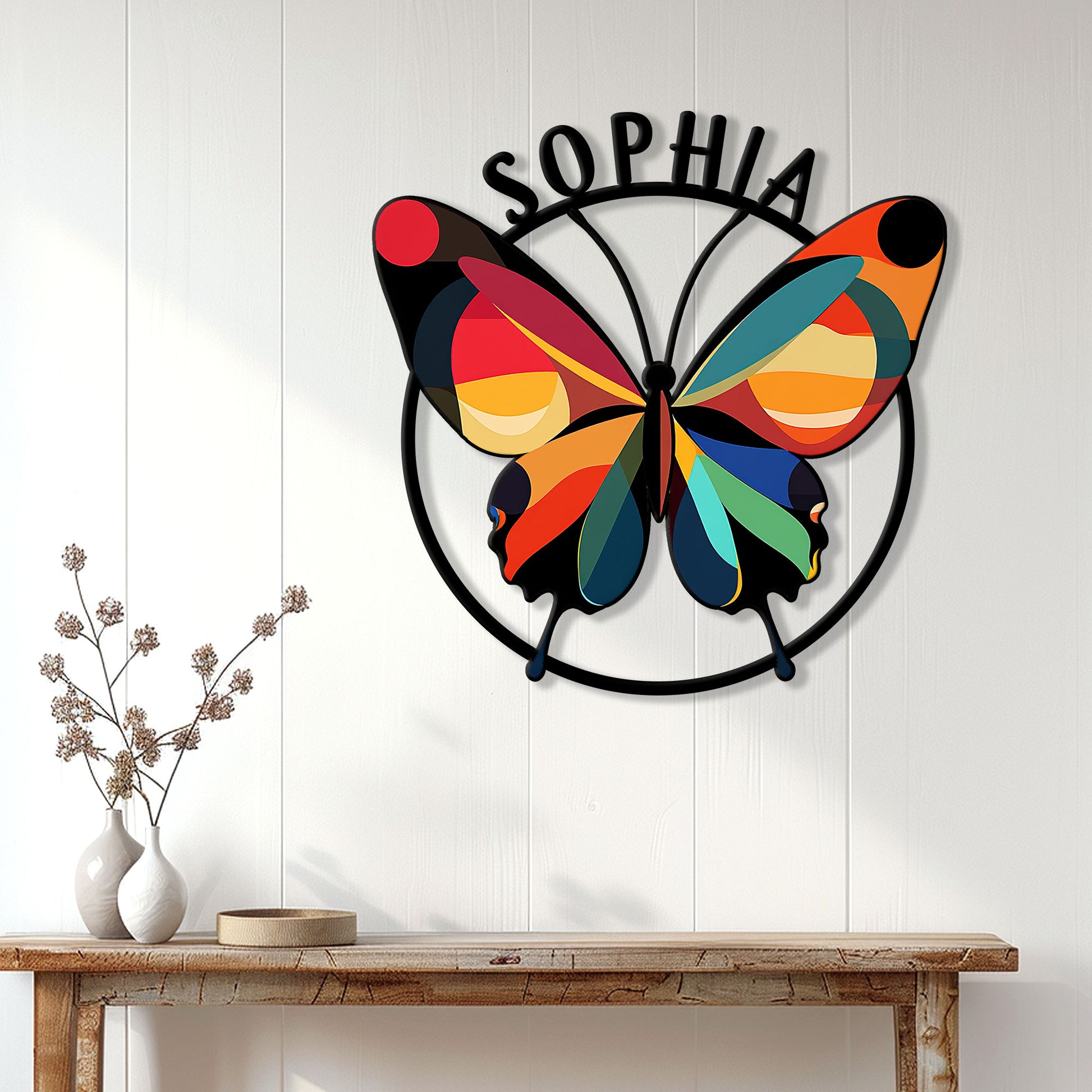 Colorful butterfly wall sign displayed on a light wood-paneled wall above a console table
