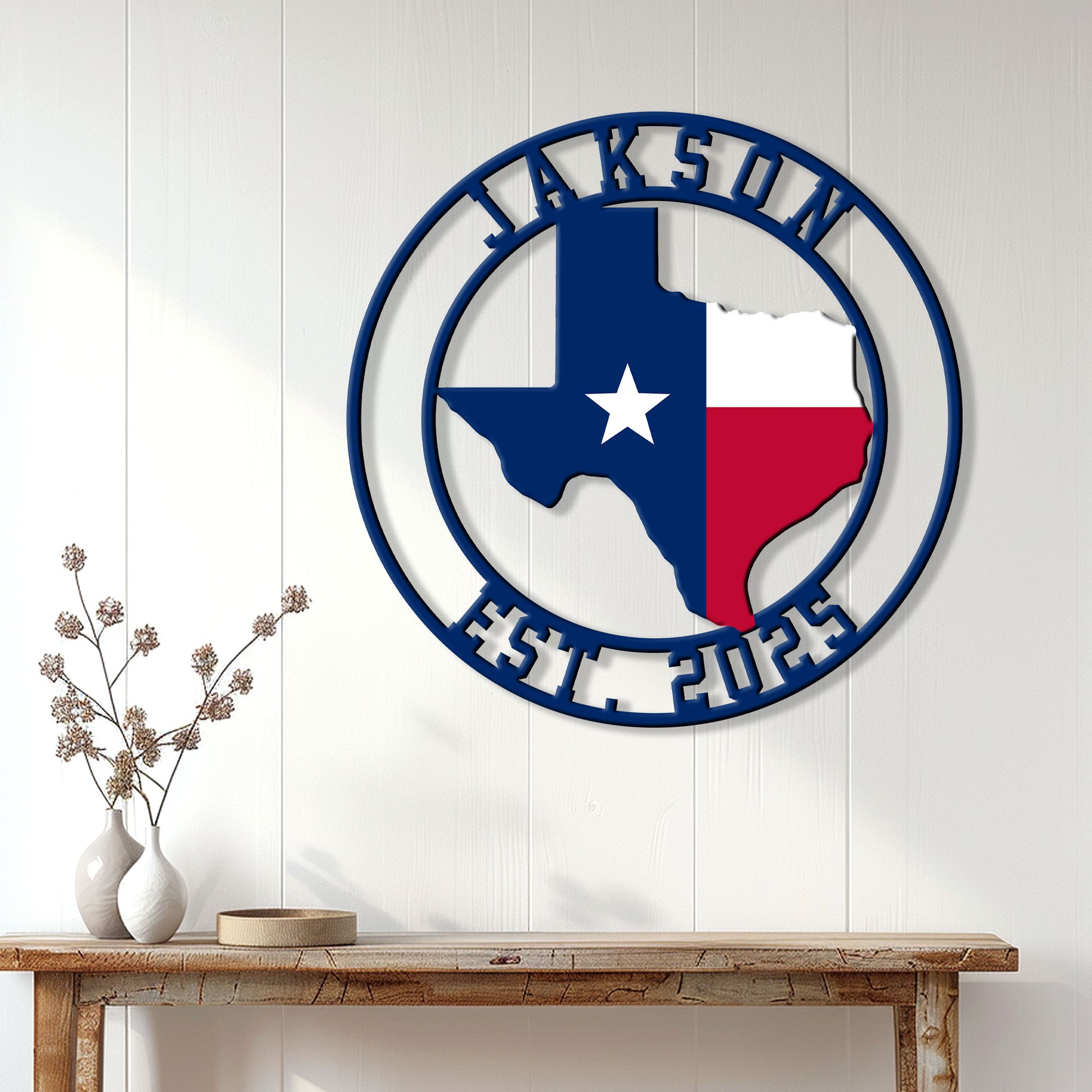 Texas state flag metal wall sign displayed on a white paneled wall above a rustic console table