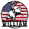 Rodeo metal sign featuring a cowboy bull rider against a distressed American flag and barbed wire frame