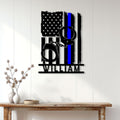 Thin blue line police metal sign displayed as wall decor in a bright home entryway