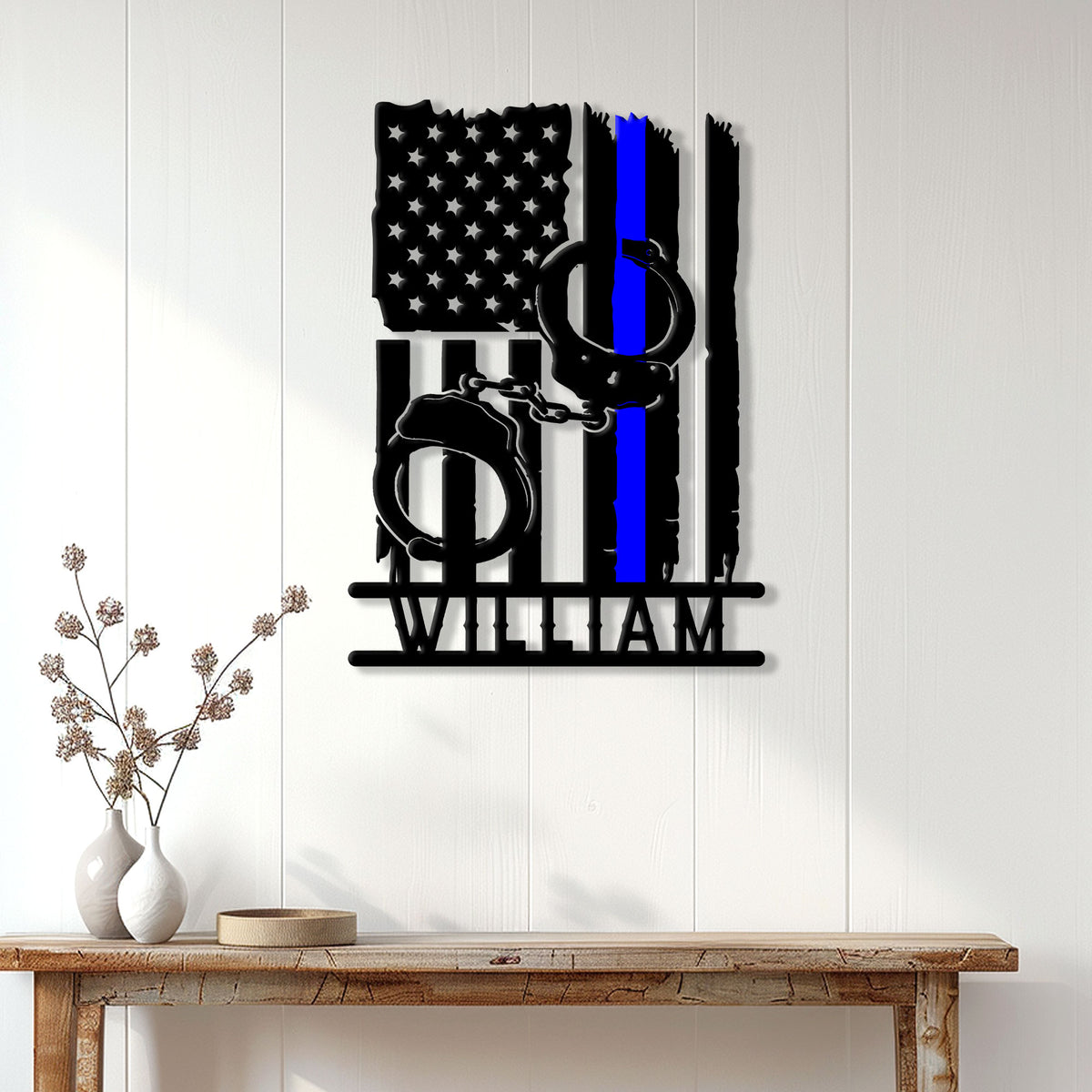 Thin blue line police metal sign displayed as wall decor in a bright home entryway