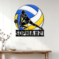 Volleyball wall decor displayed on a white paneled wall above a console table