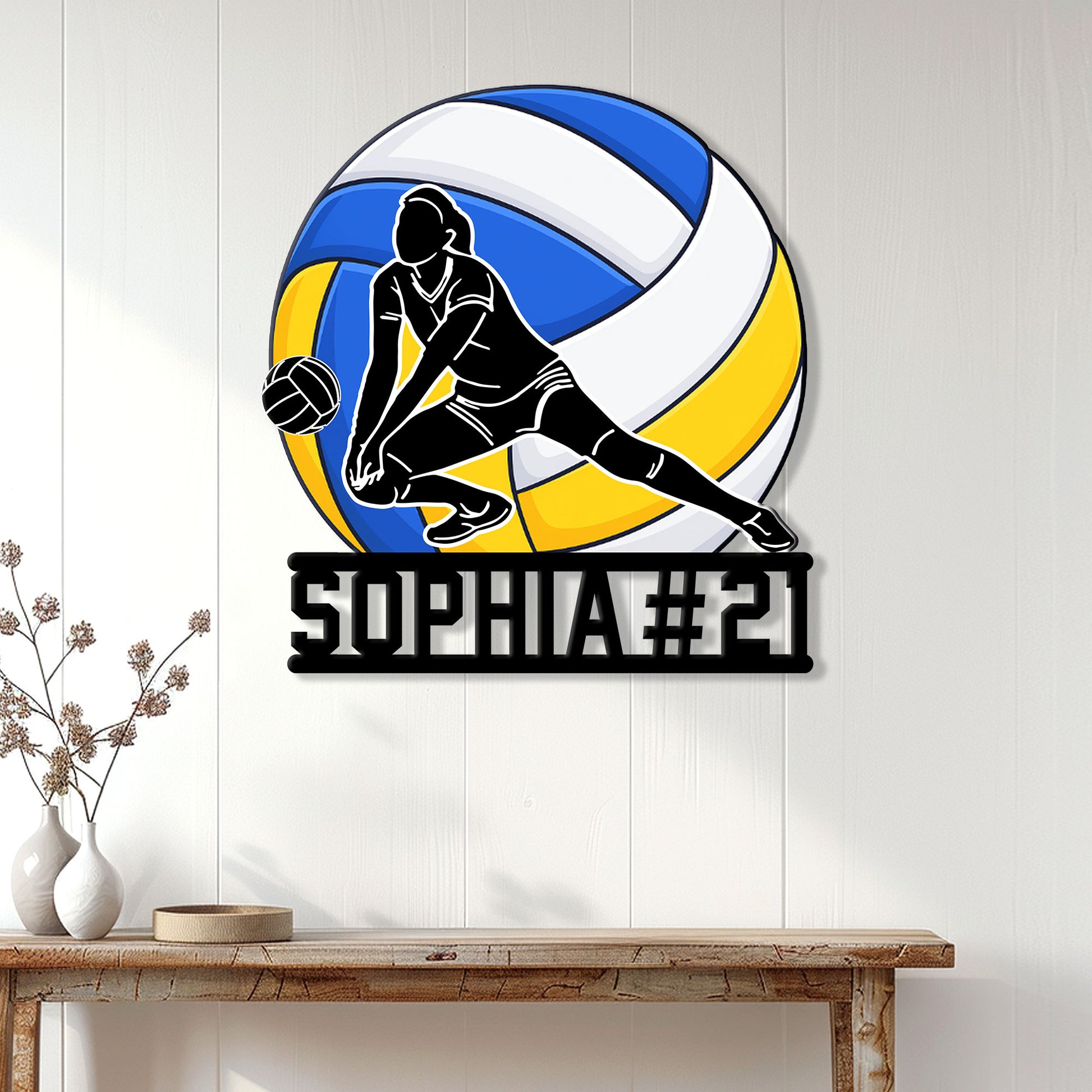 Volleyball wall decor displayed on a white paneled wall above a console table