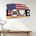 Patriotic baseball wall sign displayed on a white paneled wall above a wooden console table
