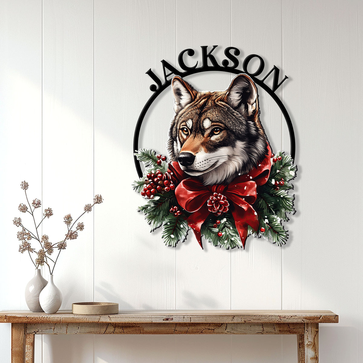 Christmas wolf wall sign displayed on a white paneled wall above a console table