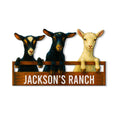 Custom goat ranch metal sign featuring three colorful goats leaning over a rustic wooden fence
