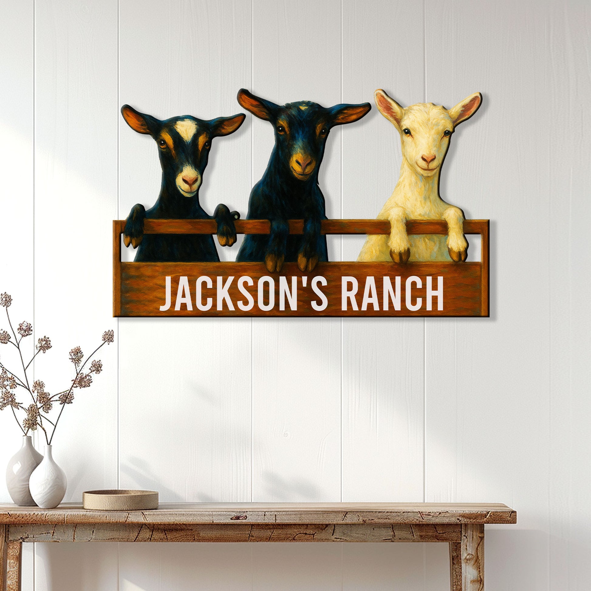 Goat ranch wall sign displayed on white farmhouse paneling above a rustic console table