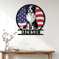Patriotic Border Collie wall sign displayed on a light wood-paneled wall above a console table