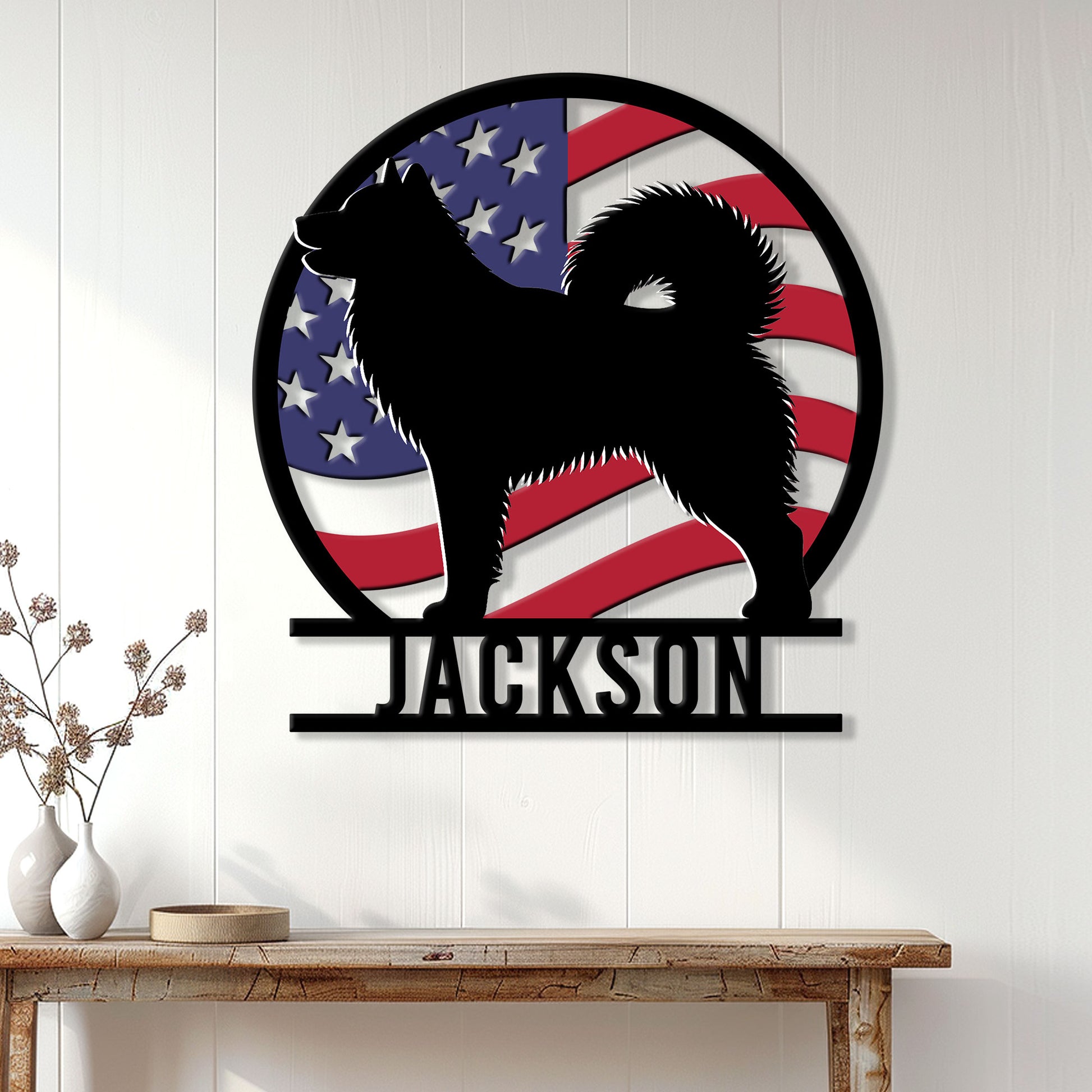 Patriotic Alaskan Malamute metal wall sign displayed in a bright home interior