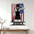 Patriotic women's wrestling wall decor displayed on a light wood wall above a console table