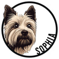 Close-up Yorkie portrait on a circular metal sign with a bold black border and decorative lettering