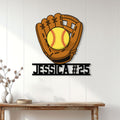 Softball wall sign displayed on white paneled decor above a console table