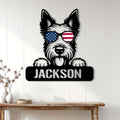 Patriotic Scottish Terrier metal sign displayed on a light wood wall above a console table