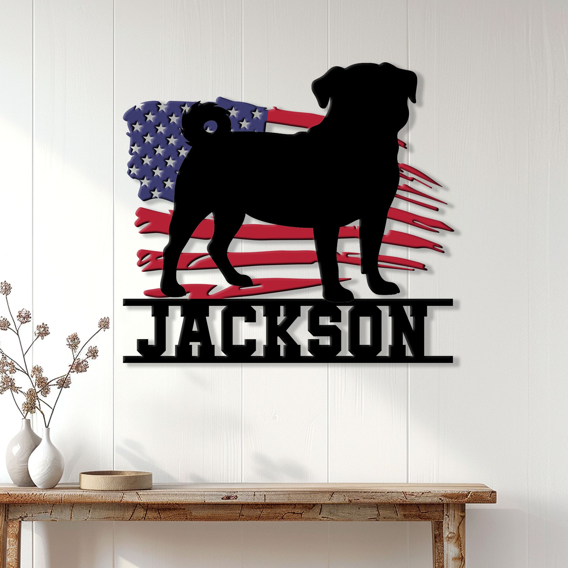 Patriotic pug wall sign displayed on a white paneled wall above a console table