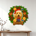 Goldendoodle Christmas wall sign displayed on a white paneled wall above a wood console table
