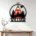 Native American wall decor displayed on a light wood wall, featuring a teepee, eagle, trees, and mountain landscape