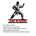 Karate metal sign featuring a martial artist in a strong fighting stance and bold red lettering