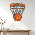 Basketball metal wall sign displayed on a light paneled wall above a console table