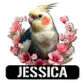 Cockatiel metal sign featuring a colorful bird surrounded by pink blossoms and a bold sign panel