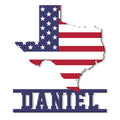 Texas-shaped metal sign featuring an American flag design and bold patriotic wall decor styling