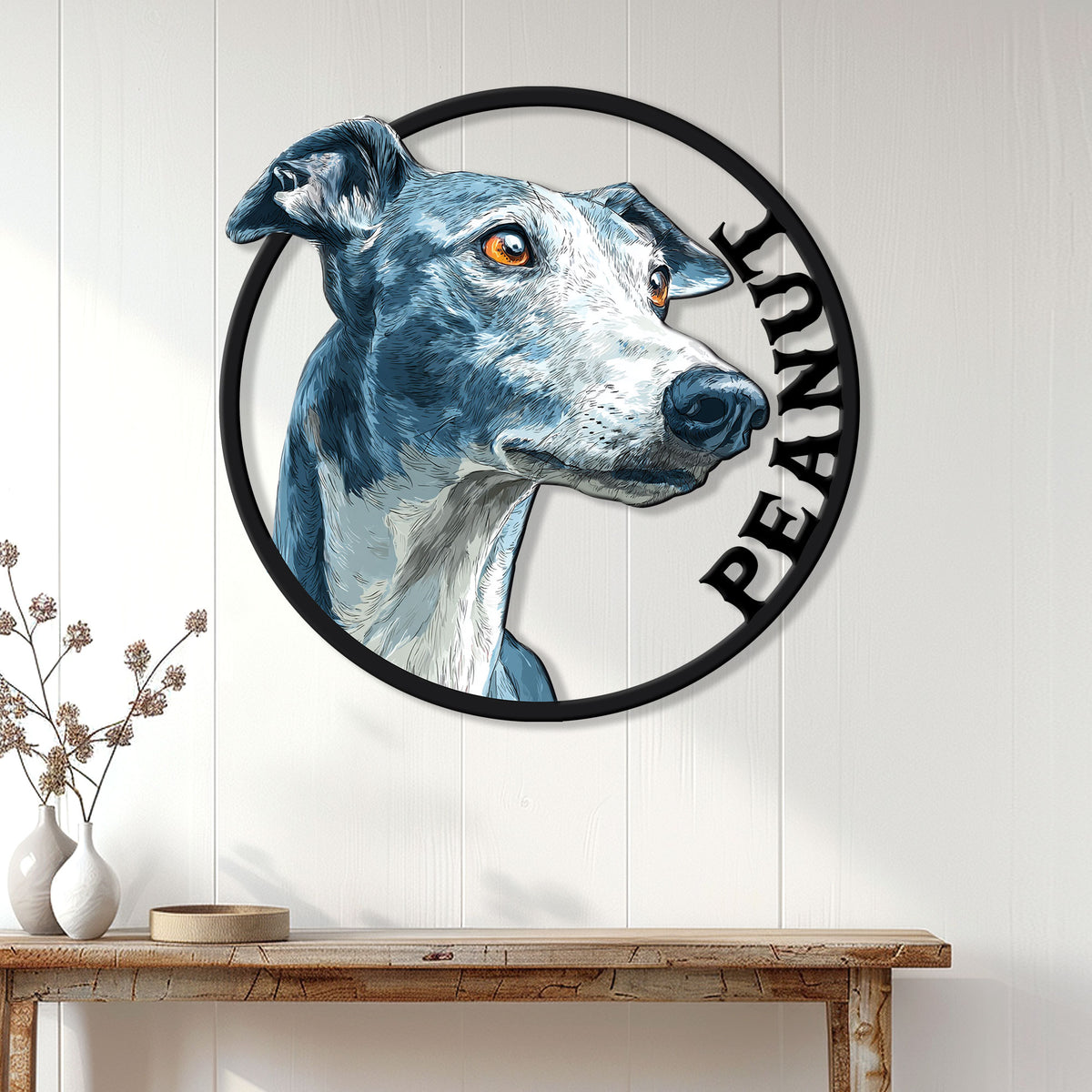 Greyhound wall sign displayed above a console table in a bright, modern farmhouse-style entryway