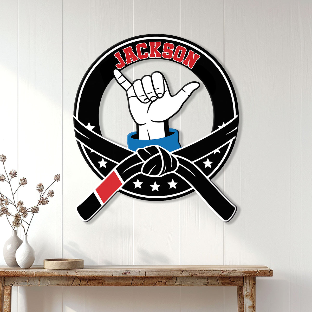 Jiu Jitsu metal sign displayed on a white paneled wall above a wooden console table