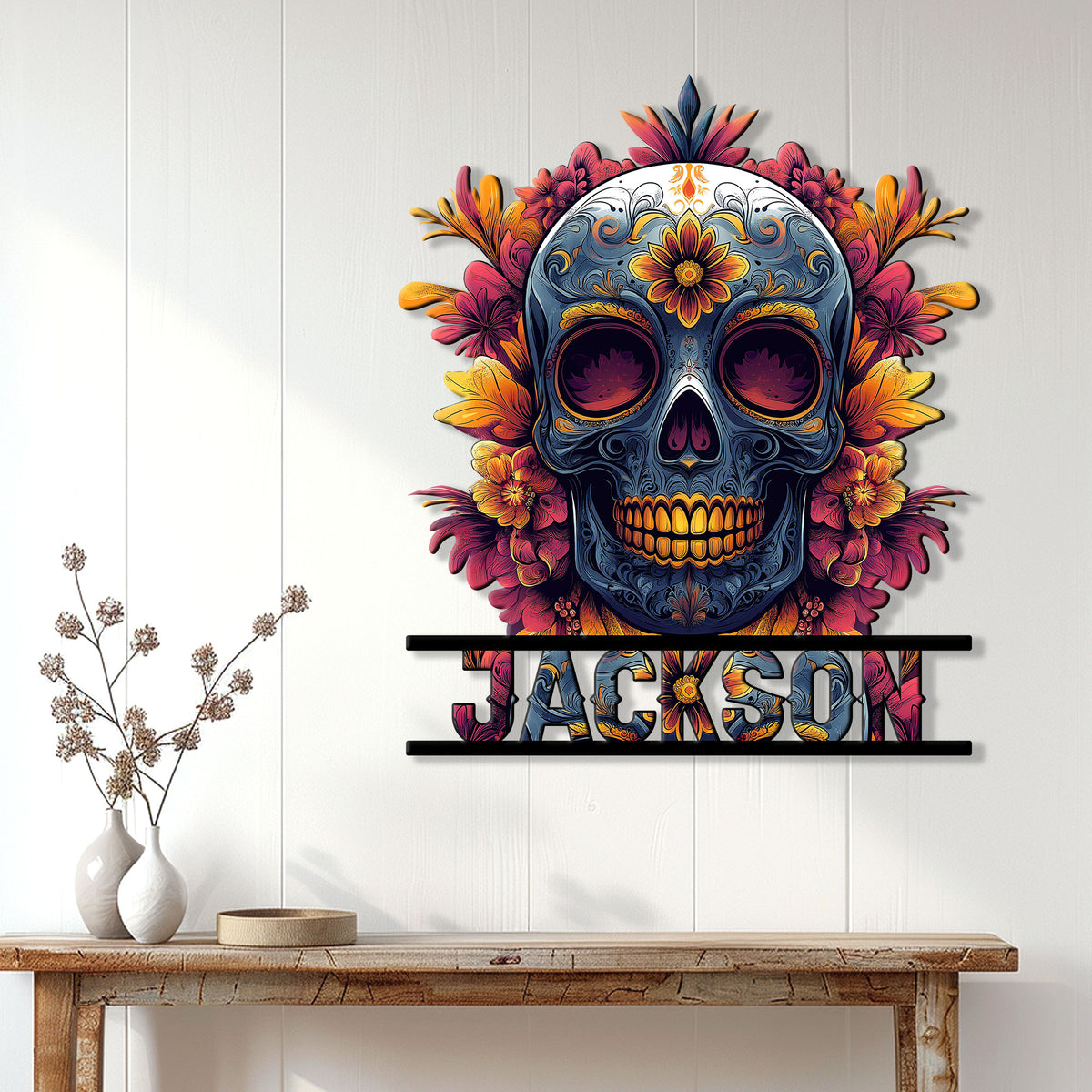 Floral sugar skull metal sign displayed on a white paneled wall above a rustic console table