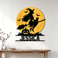 Halloween witch metal wall sign displayed on a white wood wall above a console table